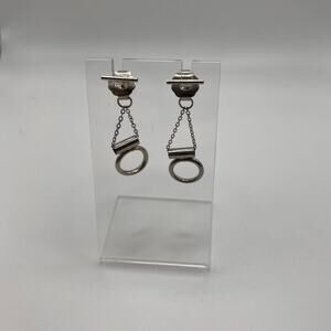 Bar stud earrings with geometric dangles attached to the back